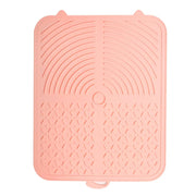 Tapis Nidofé Pause rose vu de dessus, avec zones texturées et deux petites oreilles.