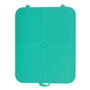 Tapis Nidofé Pause turquoise vu de dessus, avec zones texturées et deux petites oreilles.