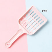Pelle à litière Nidofé Maille rose, à tête rectangulaire ajourée.